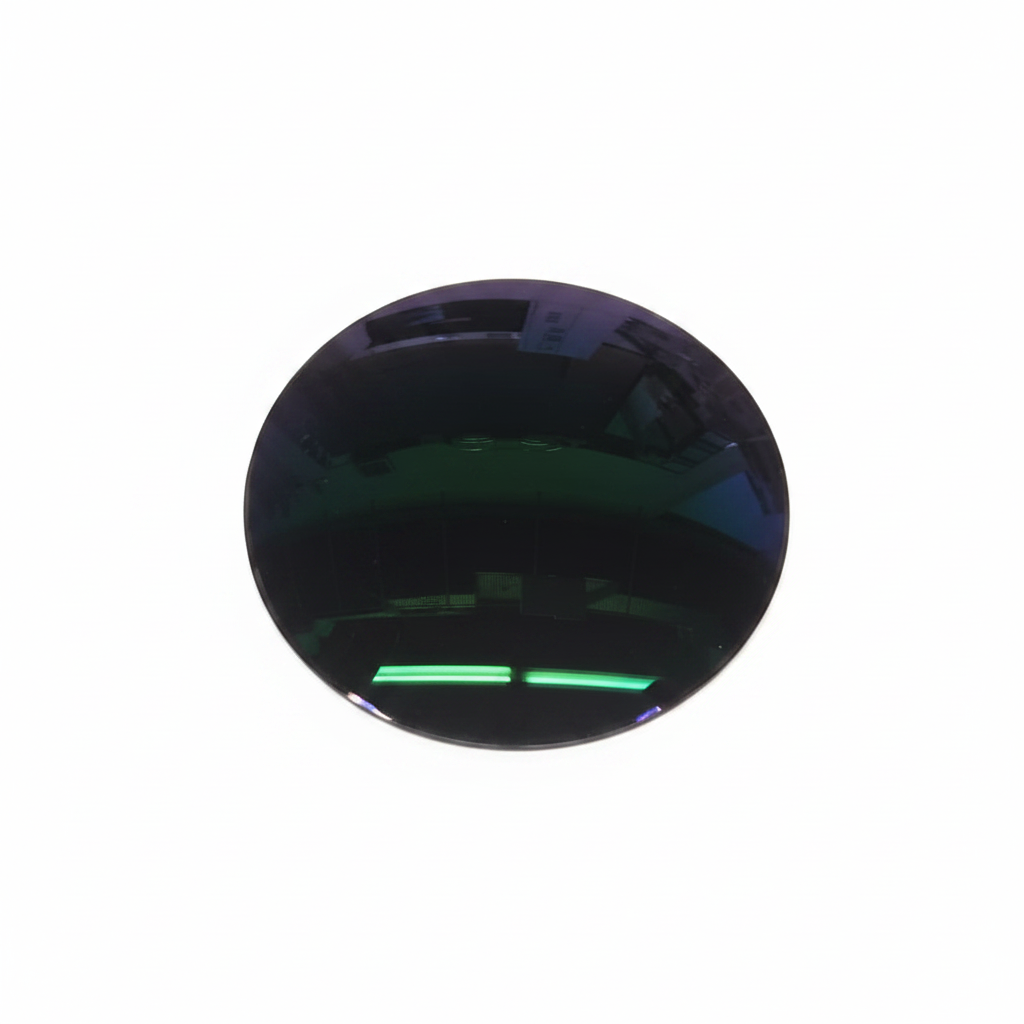 Poly Photo Gray SHMC + Blue Shield lens on white background showing green coating reflection
